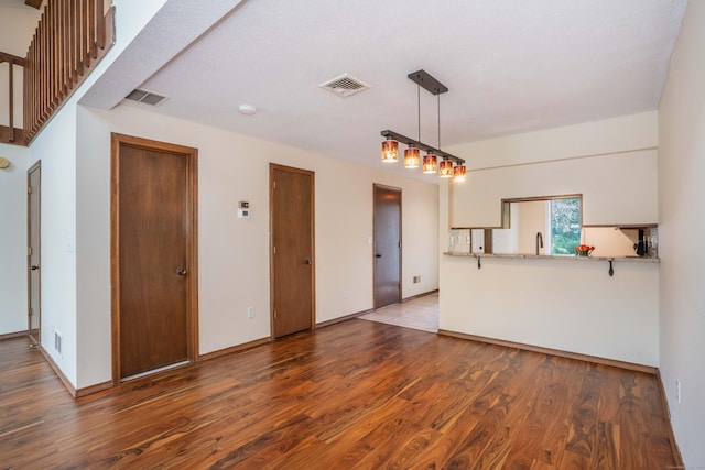 80 Copper Beech Dr Unit 80, Rocky Hill, CT 06067 - unfurnished living room with wood finished floors and baseboards