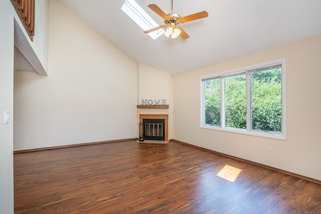80 Copper Beech Dr Unit 80, Rocky Hill, CT 06067 - unfurnished living room featuring vaulted ceiling, dark wood-type flooring, a fireplace with flush hearth, a ceiling fan, and a skylight