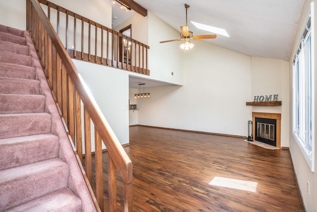 80 Copper Beech Dr Unit 80, Rocky Hill, CT 06067 - stairs with wood finished floors, ceiling fan, a fireplace with flush hearth, plenty of natural light, and high vaulted ceiling