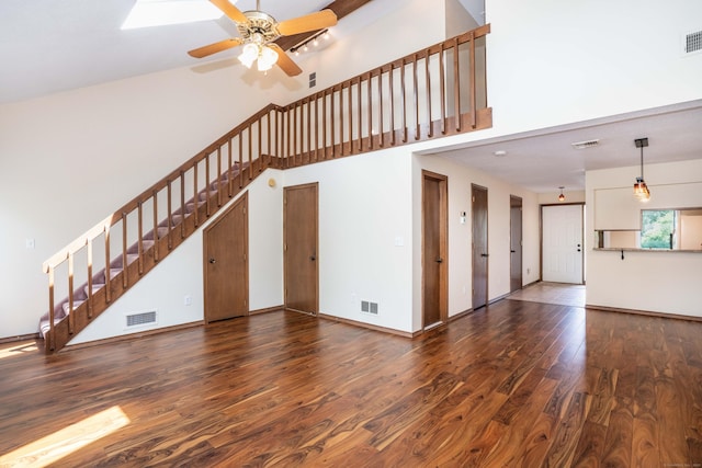 80 Copper Beech Dr Unit 80, Rocky Hill, CT 06067 - unfurnished living room featuring stairway, wood finished floors, a high ceiling, and ceiling fan