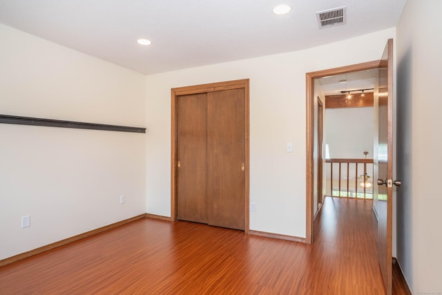 80 Copper Beech Dr Unit 80, Rocky Hill, CT 06067 - unfurnished bedroom with wood finished floors, a closet, and recessed lighting