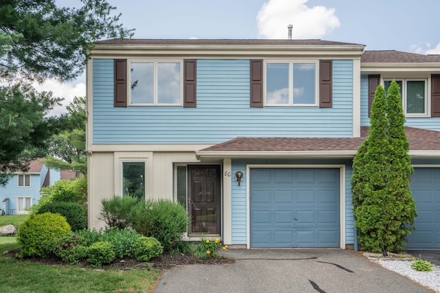 80 Copper Beech Dr Unit 80, Rocky Hill, CT 06067 - townhome / multi-family property featuring an attached garage, driveway, and roof with shingles