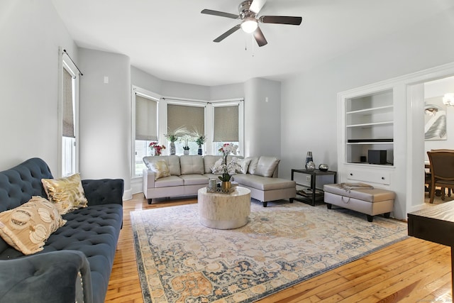 93 S St, Bristol, CT 06010 - living room featuring a ceiling fan, light wood-type flooring, and built in shelves