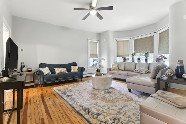 93 S St, Bristol, CT 06010 - living room featuring a ceiling fan, light wood-type flooring, and a baseboard heating unit