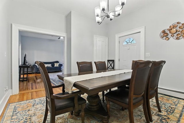 93 S St, Bristol, CT 06010 - dining area featuring a chandelier, a baseboard radiator, and light wood finished floors
