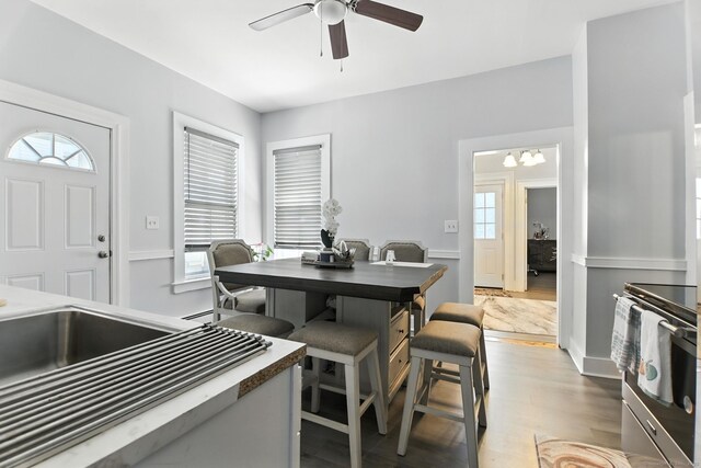 93 S St, Bristol, CT 06010 - dining space with a ceiling fan, wood finished floors, and a chandelier
