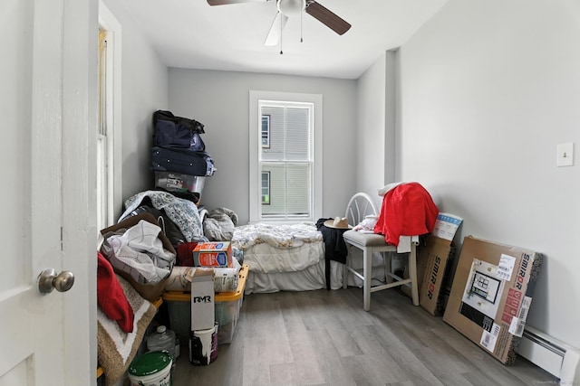 93 S St, Bristol, CT 06010 - bedroom featuring wood finished floors, ceiling fan, and a baseboard heating unit