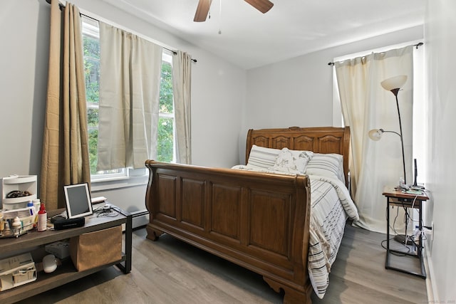 93 S St, Bristol, CT 06010 - bedroom with wood finished floors, baseboard heating, a ceiling fan, and a desk