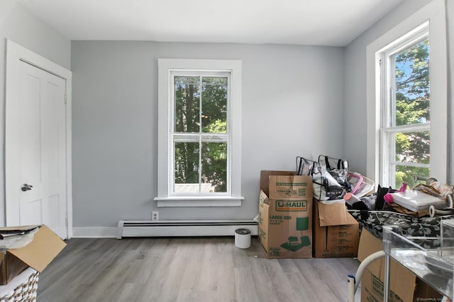 93 S St, Bristol, CT 06010 - misc room with a baseboard heating unit, plenty of natural light, and wood finished floors