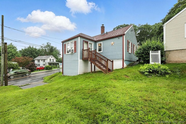 85 Peck St, Berlin, CT 06037 - rear view of property featuring a chimney, a lawn, cooling unit, and a shingled roof