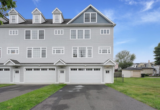 157 Brentwood Ave Unit 157, Fairfield, CT 06825 - townhome / multi-family property with a front lawn, driveway, and a garage