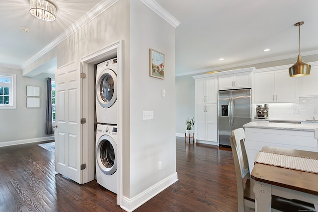 157 Brentwood Ave Unit 157, Fairfield, CT 06825 - washroom with stacked washer / dryer, crown molding, dark wood-style flooring, and recessed lighting