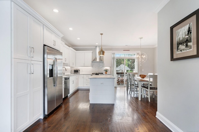 157 Brentwood Ave Unit 157, Fairfield, CT 06825 - kitchen with appliances with stainless steel finishes, wall chimney range hood, dark wood-style floors, backsplash, and ornamental molding