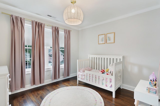 157 Brentwood Ave Unit 157, Fairfield, CT 06825 - bedroom featuring wood finished floors, ornamental molding, and a nursery area