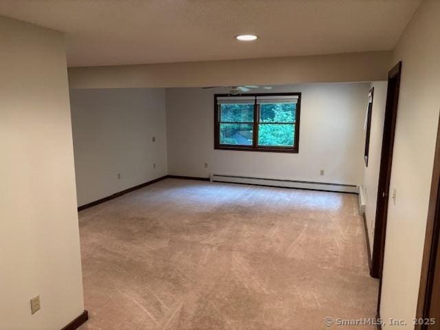 56 Cedar Swamp Rd, Mansfield, CT 06268 - empty room with a baseboard radiator, light carpet, and recessed lighting