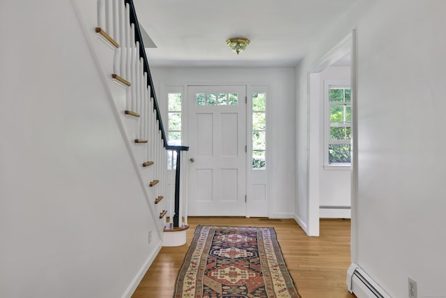 3 Deerfield Dr, Clinton, CT 06413 - entrance foyer with light wood finished floors, baseboard heating, and stairway
