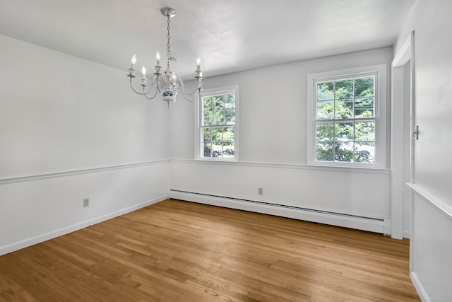 3 Deerfield Dr, Clinton, CT 06413 - unfurnished room with a baseboard heating unit, wood finished floors, and a chandelier