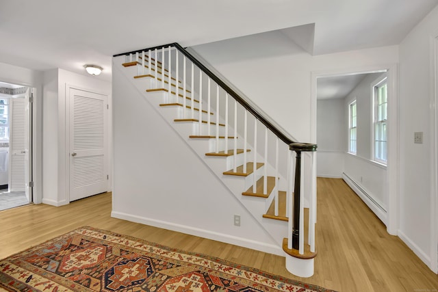 3 Deerfield Dr, Clinton, CT 06413 - stairway with wood finished floors and a baseboard heating unit