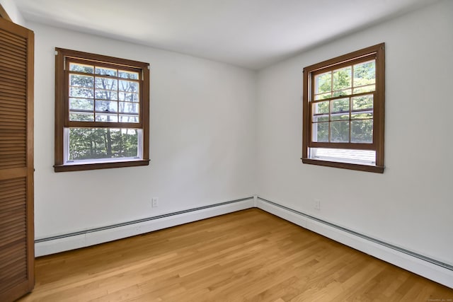 3 Deerfield Dr, Clinton, CT 06413 - empty room with plenty of natural light, light wood-style flooring, and baseboard heating