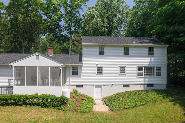3 Deerfield Dr, Clinton, CT 06413 - rear view of house with a sunroom, a lawn, roof with shingles, and a chimney