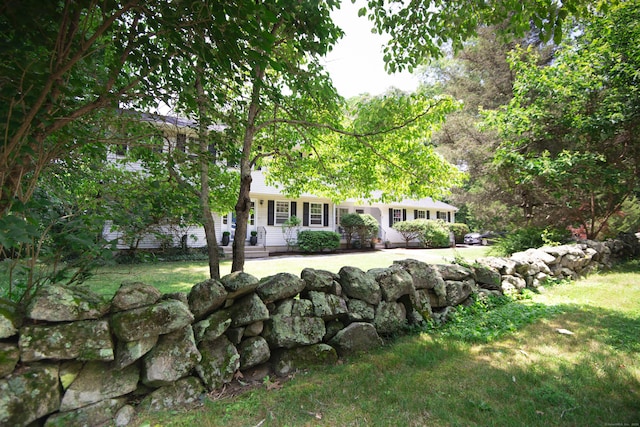 3 Deerfield Dr, Clinton, CT 06413 - view of property hidden behind natural elements featuring a front lawn