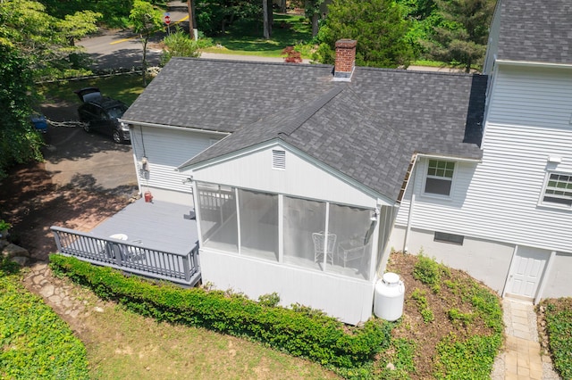3 Deerfield Dr, Clinton, CT 06413 - rear view of property with roof with shingles, a sunroom, and a chimney