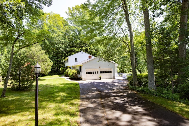 3 Deerfield Dr, Clinton, CT 06413 - view of front of house featuring driveway, a garage, and a front lawn