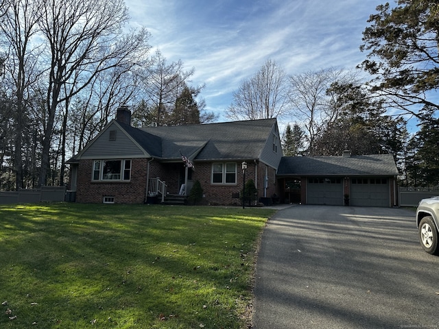 4380 Whitney Ave, Hamden, CT 06518 - view of front of property featuring asphalt driveway, an attached garage, brick siding, and a chimney