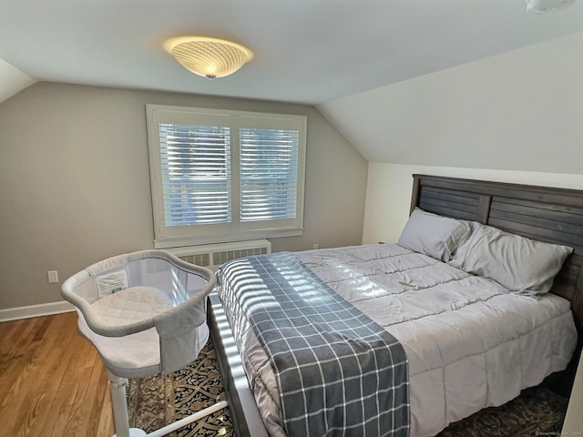 4380 Whitney Ave, Hamden, CT 06518 - bedroom with lofted ceiling and wood finished floors