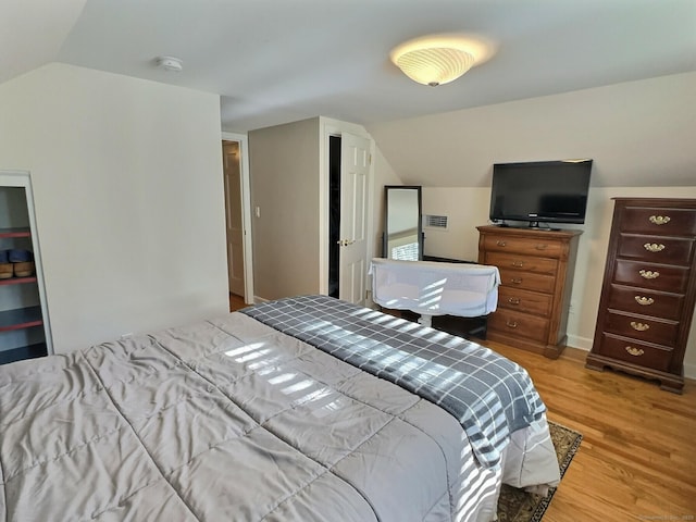 4380 Whitney Ave, Hamden, CT 06518 - bedroom with lofted ceiling and wood finished floors