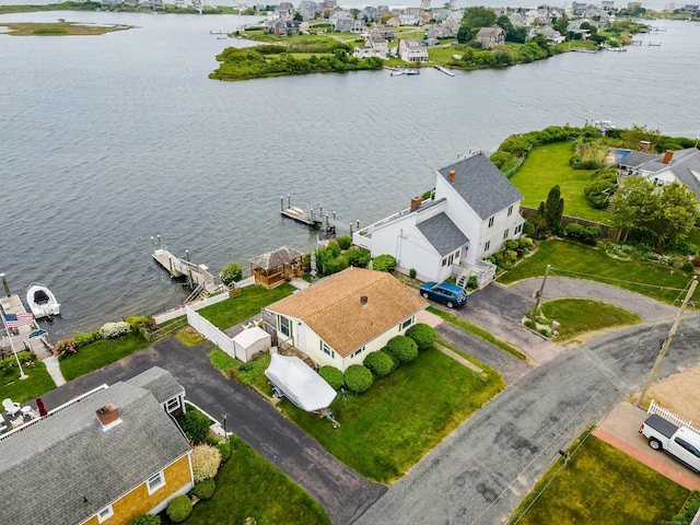 aerial view of residential area with a large body of water