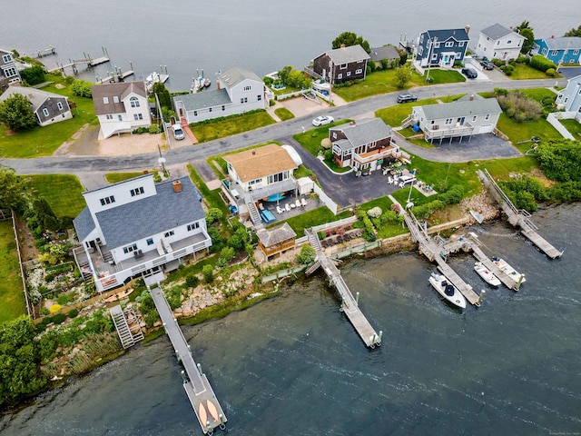 aerial perspective of suburban area featuring a large body of water