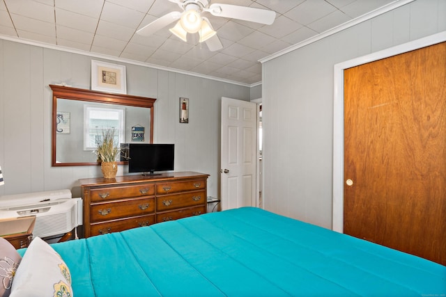bedroom with ornamental molding and ceiling fan