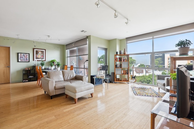 33 N Water St Unit 505, Norwalk, CT 06854 - living room with track lighting, light wood-style flooring, and a desk