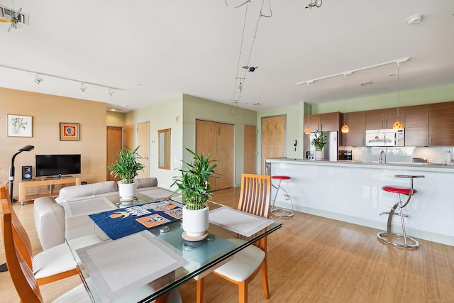 33 N Water St Unit 505, Norwalk, CT 06854 - dining space featuring rail lighting and light wood-style flooring