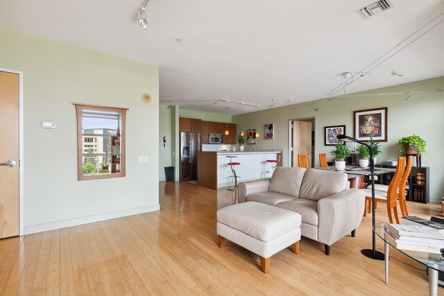 33 N Water St Unit 505, Norwalk, CT 06854 - living room featuring rail lighting and light wood finished floors
