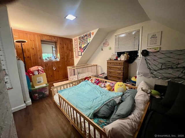 32 Beaver Hill Rd, Greenburgh, NY 10523 - bedroom with wood finished floors, wooden walls, and lofted ceiling