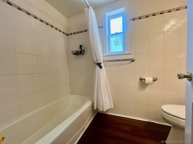 32 Beaver Hill Rd, Greenburgh, NY 10523 - full bath featuring shower / bath combo with shower curtain, wood finished floors, and tile walls