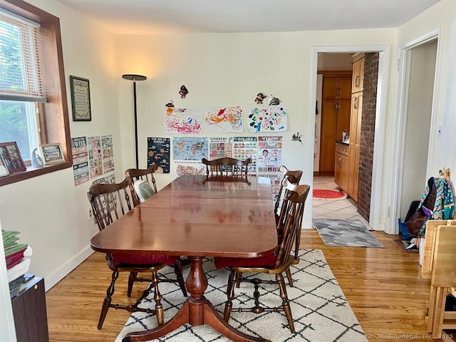 32 Beaver Hill Rd, Greenburgh, NY 10523 - dining area with light wood-style flooring and baseboards