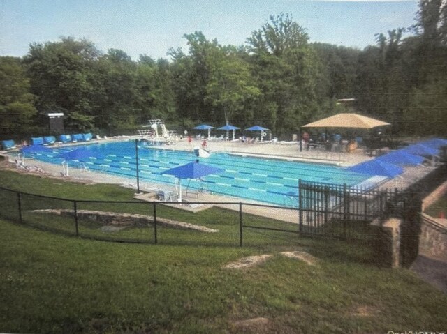 32 Beaver Hill Rd, Greenburgh, NY 10523 - community pool featuring a view of trees and a patio
