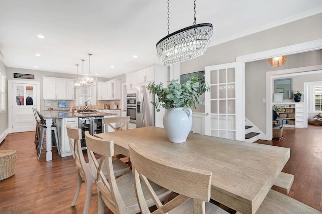 1676 Boulevard Blvd, West Hartford, CT 06107 - dining room featuring a chandelier, dark wood-style flooring, beverage cooler, healthy amount of natural light, and recessed lighting