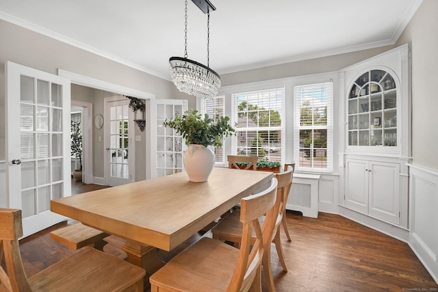 1676 Boulevard Blvd, West Hartford, CT 06107 - dining room with radiator heating unit, ornamental molding, healthy amount of natural light, and wood finished floors