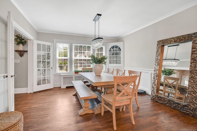 1676 Boulevard Blvd, West Hartford, CT 06107 - dining space with ornamental molding, dark wood finished floors, a chandelier, wainscoting, and radiator heating unit