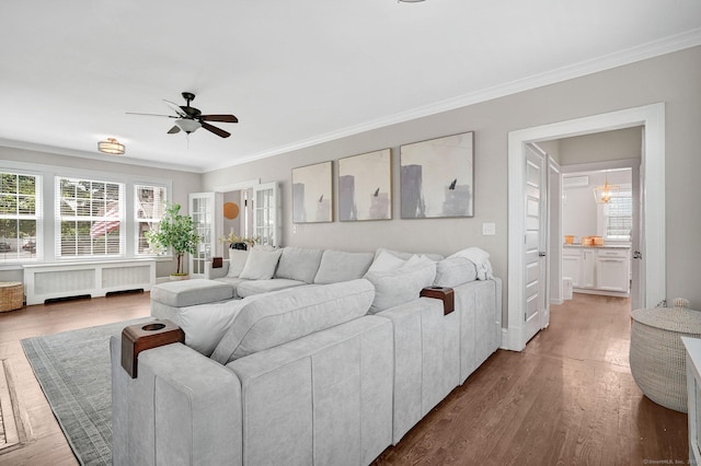 1676 Boulevard Blvd, West Hartford, CT 06107 - living area with radiator, a ceiling fan, ornamental molding, and wood finished floors