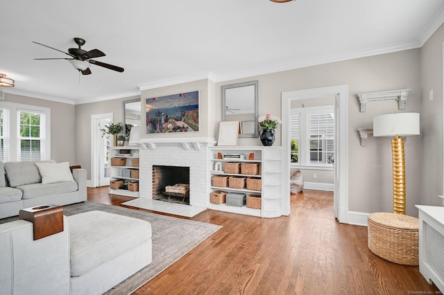 1676 Boulevard Blvd, West Hartford, CT 06107 - living area with ornamental molding, wood finished floors, ceiling fan, and a fireplace