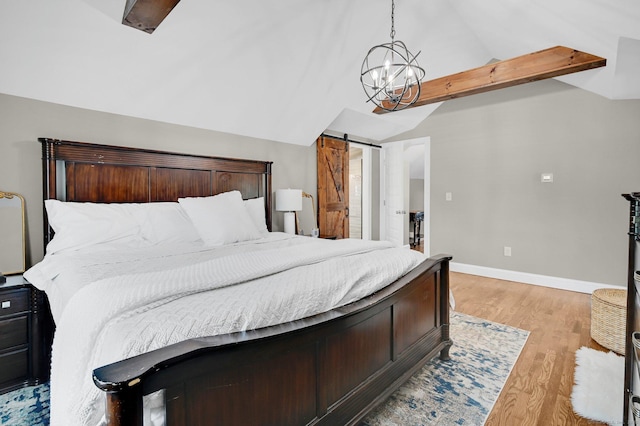 1676 Boulevard Blvd, West Hartford, CT 06107 - bedroom featuring lofted ceiling, light wood-style floors, and a barn door