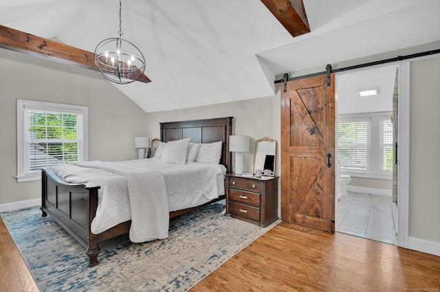 1676 Boulevard Blvd, West Hartford, CT 06107 - bedroom with a barn door, a chandelier, light wood-style flooring, and ensuite bath
