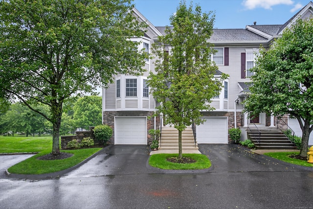 1401 Pinnacle Way Unit 1401, Danbury, CT 06811 - townhome / multi-family property with stone siding, driveway, and a garage