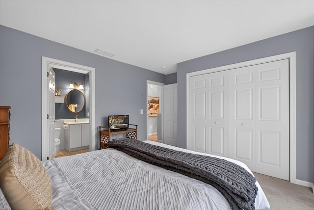 1401 Pinnacle Way Unit 1401, Danbury, CT 06811 - bedroom with a closet, ensuite bath, and light carpet