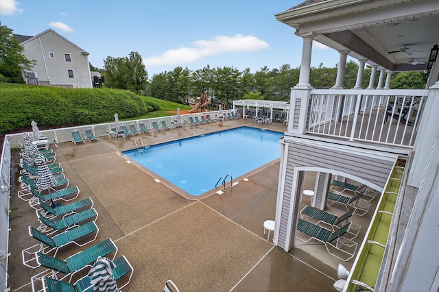1401 Pinnacle Way Unit 1401, Danbury, CT 06811 - community pool featuring a patio area, a ceiling fan, and view of scattered trees